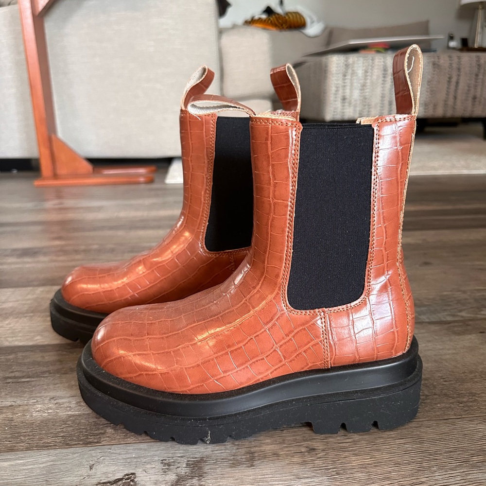 Orange and black boots, size 8.